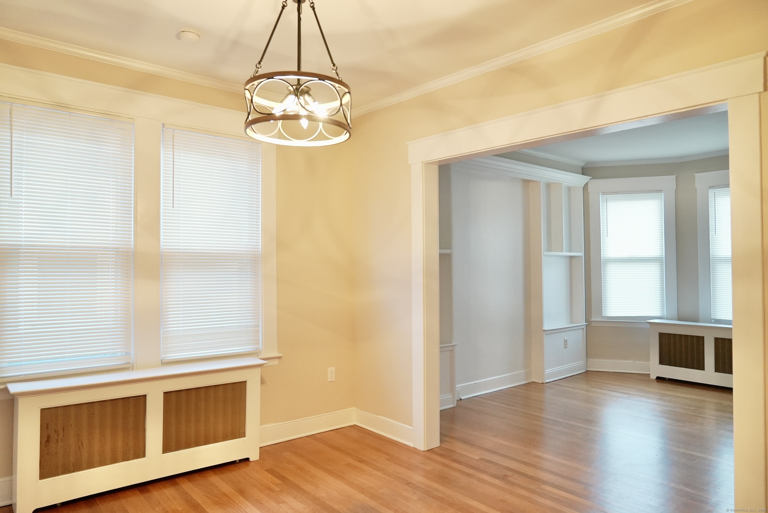 39 Pardee Place New Haven, CT 06515 - Photo 8 of 32 a view of an empty room with wooden floor and a window