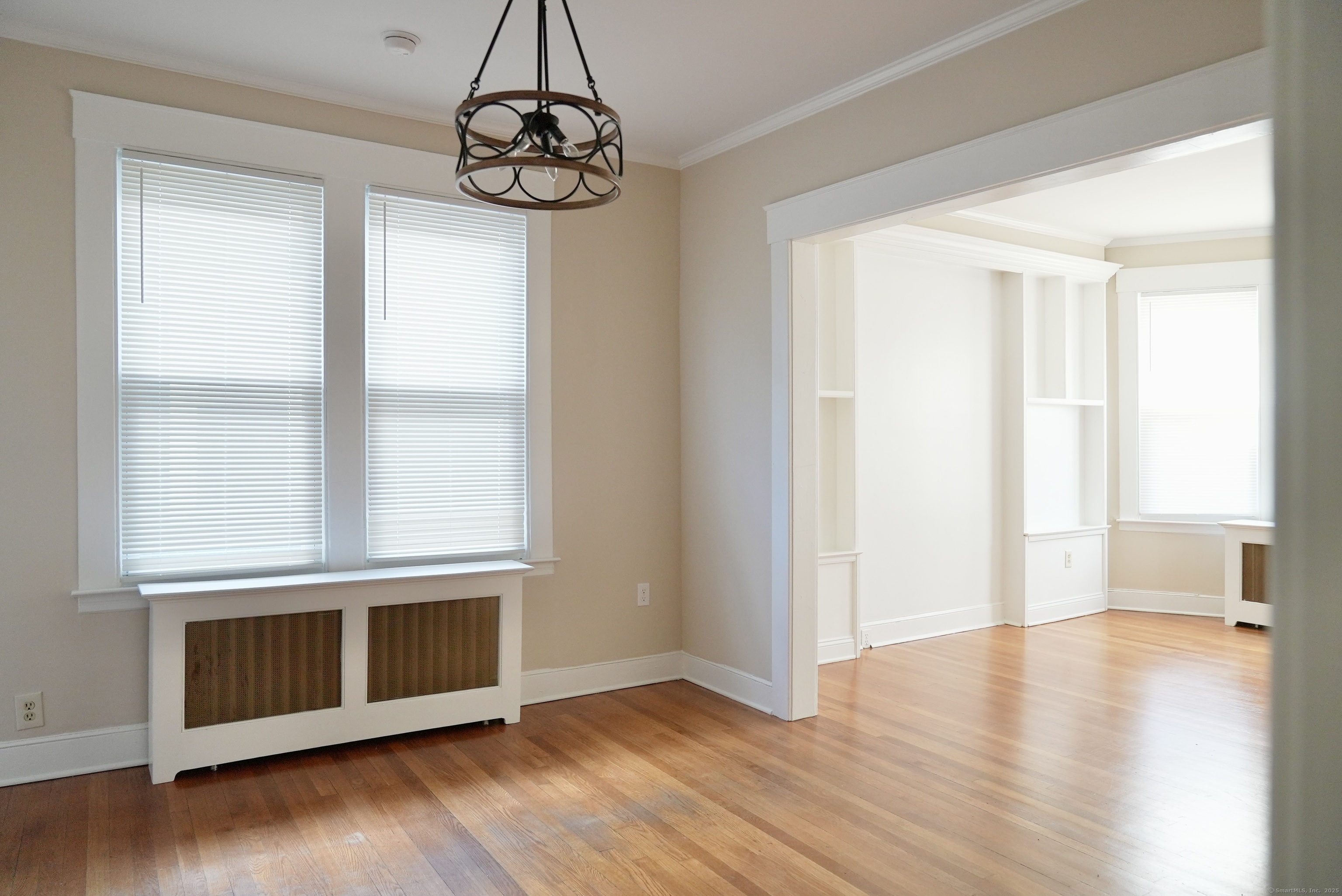 39 Pardee Place New Haven, CT 06515 - Photo 9 of 32 a view of an empty room with wooden floor and a window