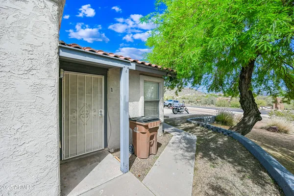 a backyard of a house with seating space