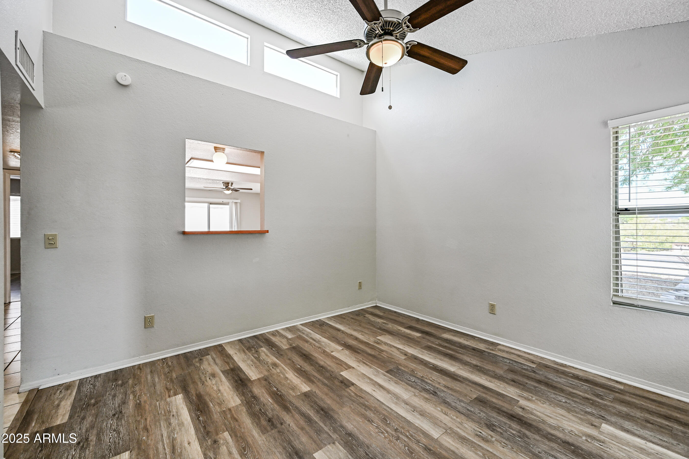 5580 South Kings Ranch Road, Unit 1 Gold Canyon, AZ 85118 - Photo 3 of 19 a view of a room with a window and a ceiling fan