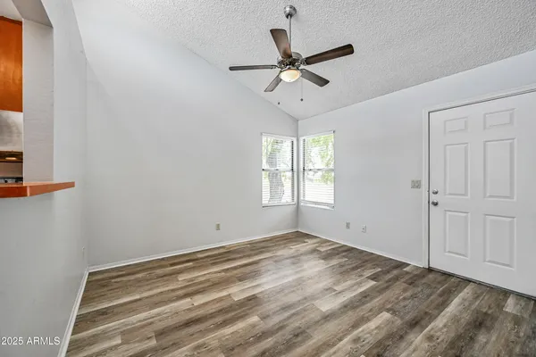 a view of an empty room with a window