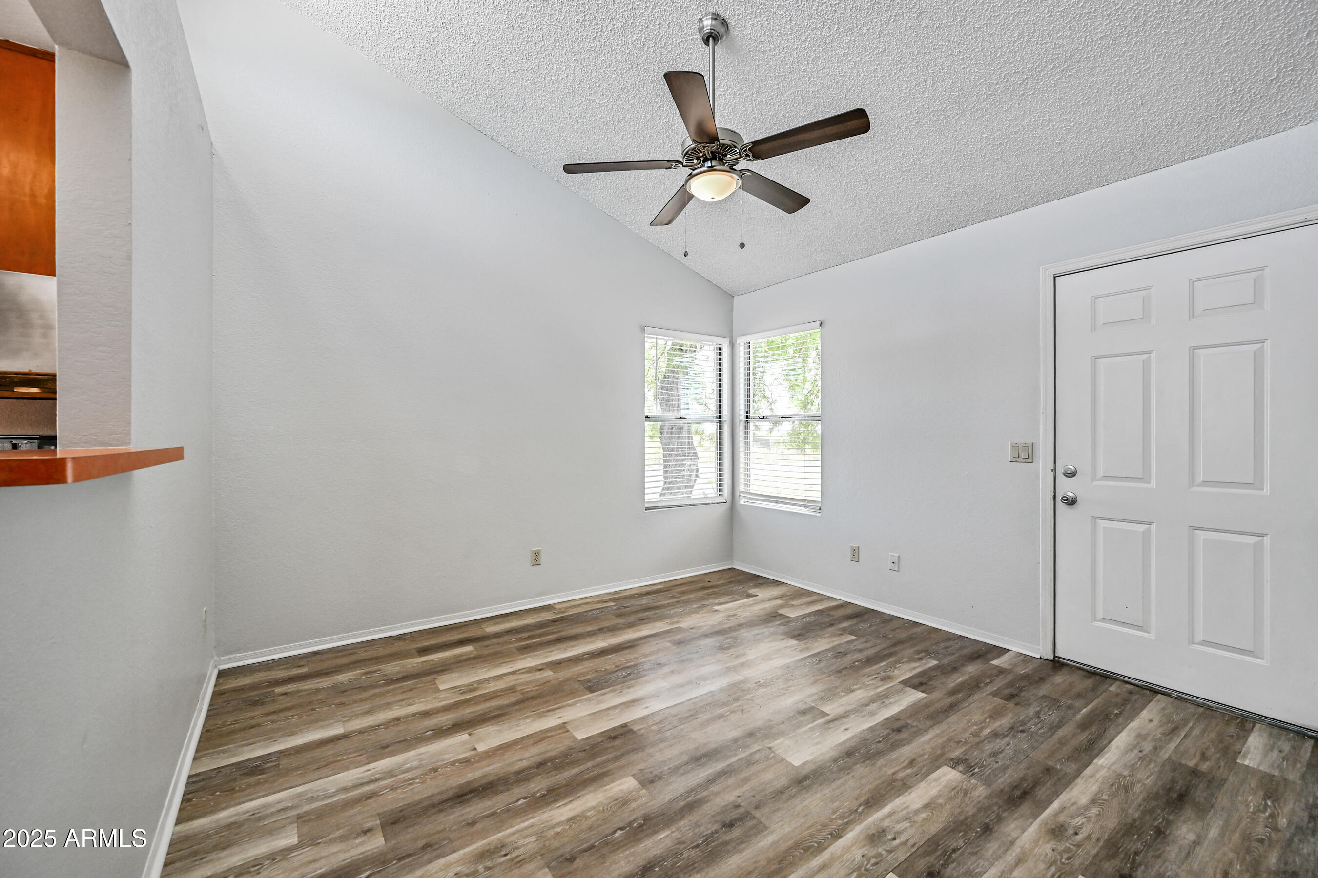 5580 South Kings Ranch Road, Unit 1 Gold Canyon, AZ 85118 - Photo 4 of 19 a view of an empty room with a window