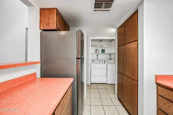 a kitchen with stainless steel appliances a refrigerator and a stove