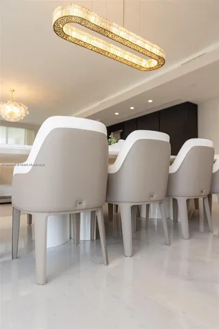 a dinning table and chairs in a room
