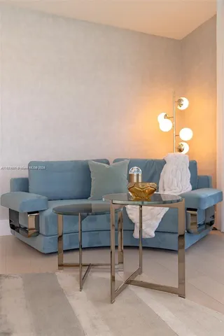 a living room with furniture and a lamp