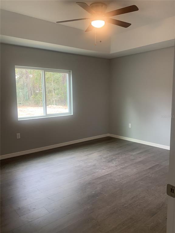 16201 Crider Road Brooksville, FL 34614 - Photo 8 of 18 an empty room with a window