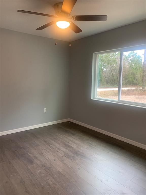 16201 Crider Road Brooksville, FL 34614 - Photo 9 of 18 an empty room with a window