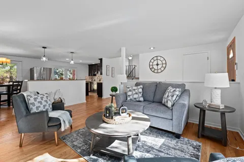 a living room with furniture and a table