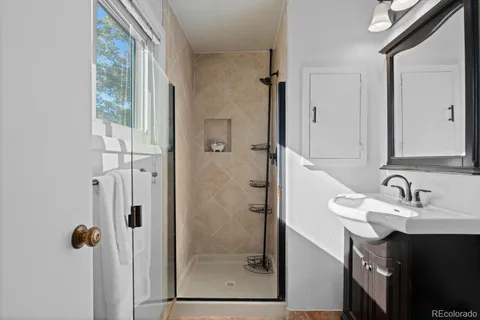 a bathroom with a sink and mirror