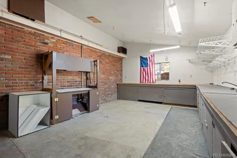 a kitchen with stainless steel appliances granite countertop a stove and a sink