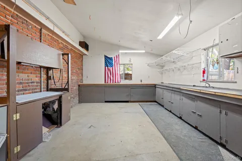 a kitchen with counter top space and cabinets