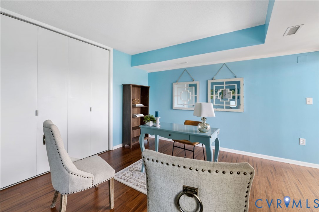 2956 Hathaway Road, Unit 903 Richmond, VA 23225 - Photo 15 of 27 a view of a dining room with furniture and wooden floor