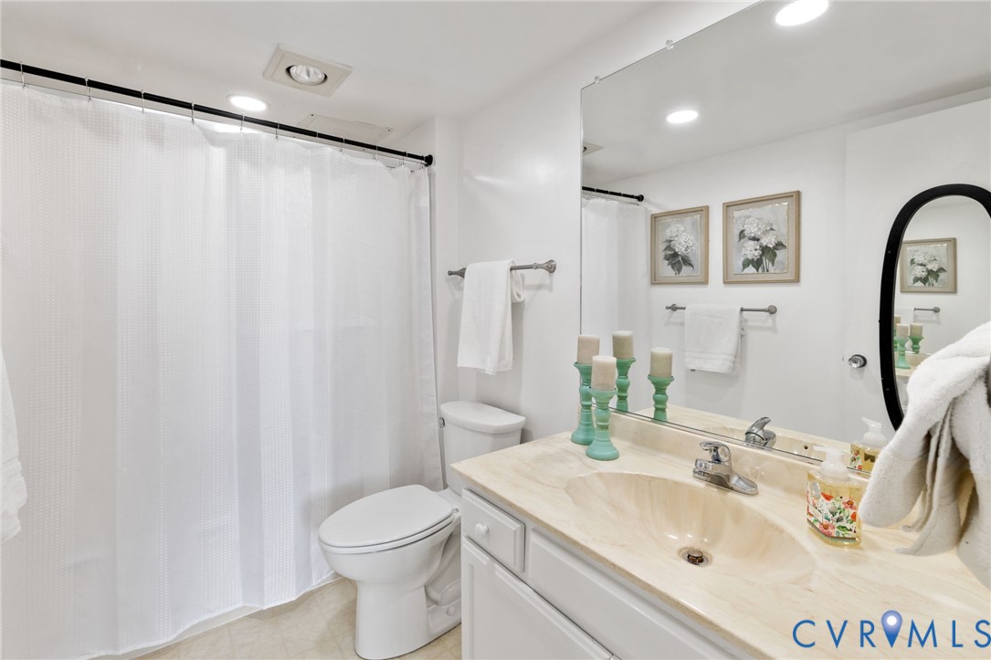 2956 Hathaway Road, Unit 903 Richmond, VA 23225 - Photo 20 of 27 a bathroom with a sink toilet and shower