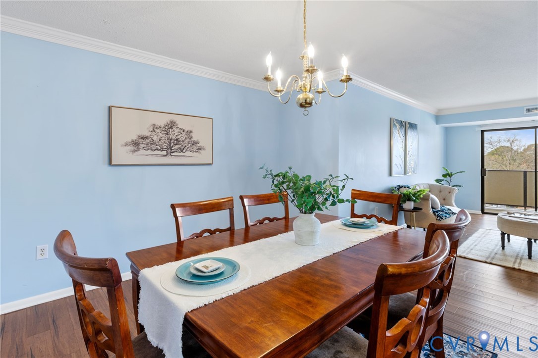 2956 Hathaway Road, Unit 903 Richmond, VA 23225 - Photo 6 of 27 a view of a dining room with furniture and wooden floor