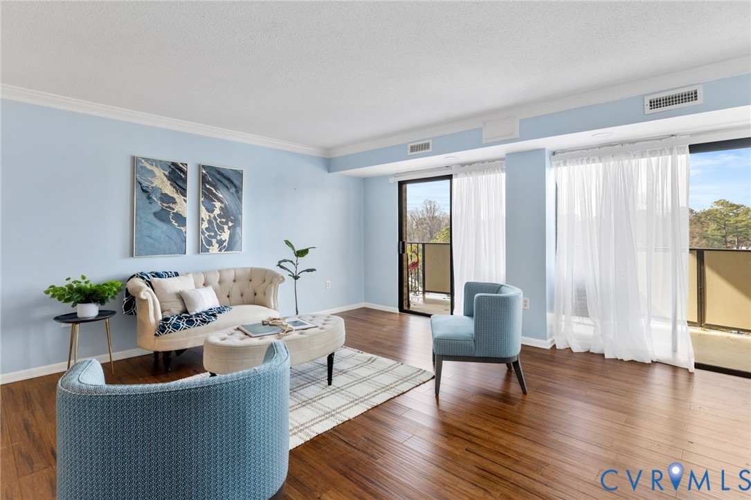 2956 Hathaway Road, Unit 903 Richmond, VA 23225 - Photo 9 of 27 a living room with furniture and floor to ceiling windows