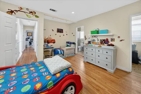 a room with furniture and a wooden floor