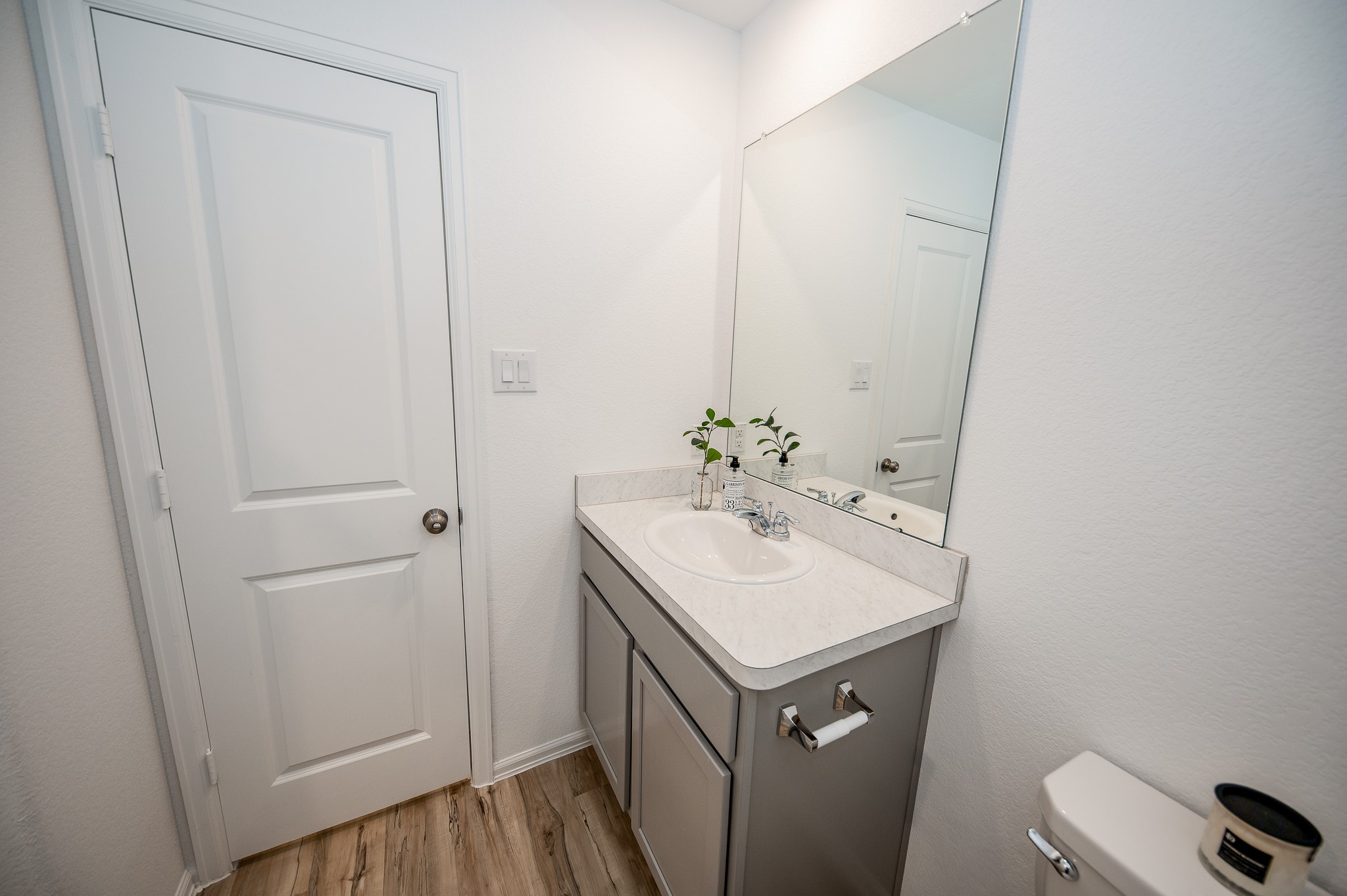 140 Austin Street Angleton, TX 77515 - Photo 25 of 27 Secondary bathroom with beautiful grey cabinets.