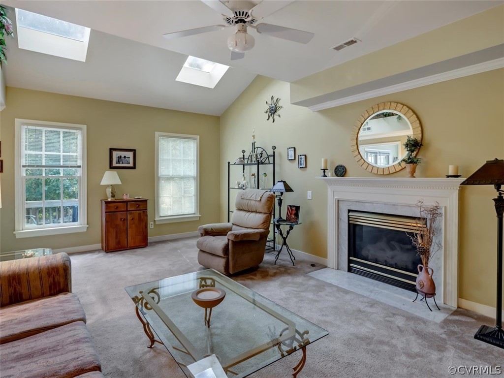 15211 Powell Grove Road Midlothian, VA 23112 - Photo 14 of 34 a living room with furniture a fireplace and a window
