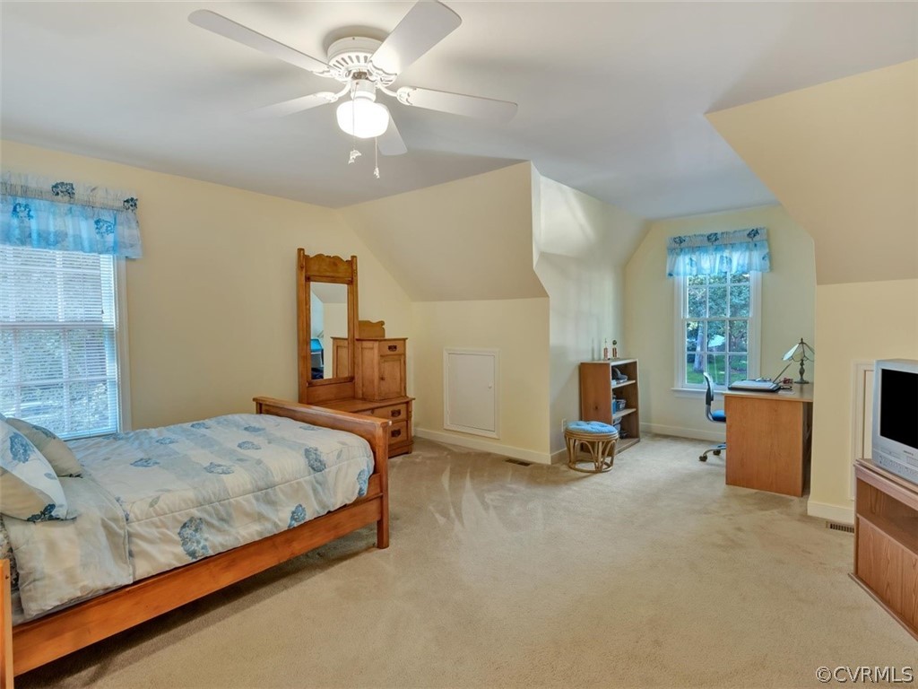 15211 Powell Grove Road Midlothian, VA 23112 - Photo 16 of 34 a bedroom with a bed a couch and dresser