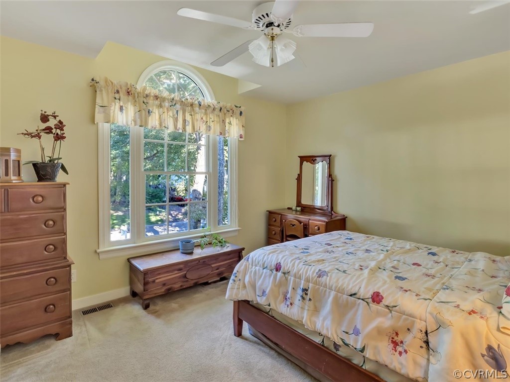 15211 Powell Grove Road Midlothian, VA 23112 - Photo 17 of 34 a bedroom with a bed and a window