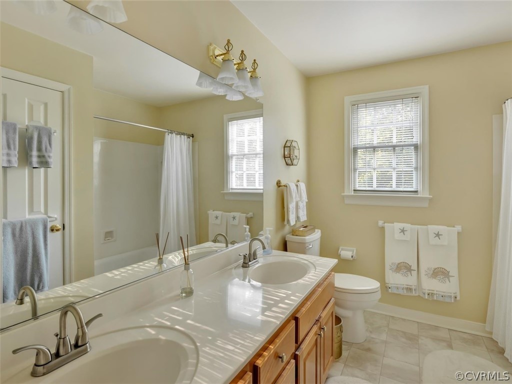 15211 Powell Grove Road Midlothian, VA 23112 - Photo 18 of 34 a bathroom with a granite countertop sink and a mirror