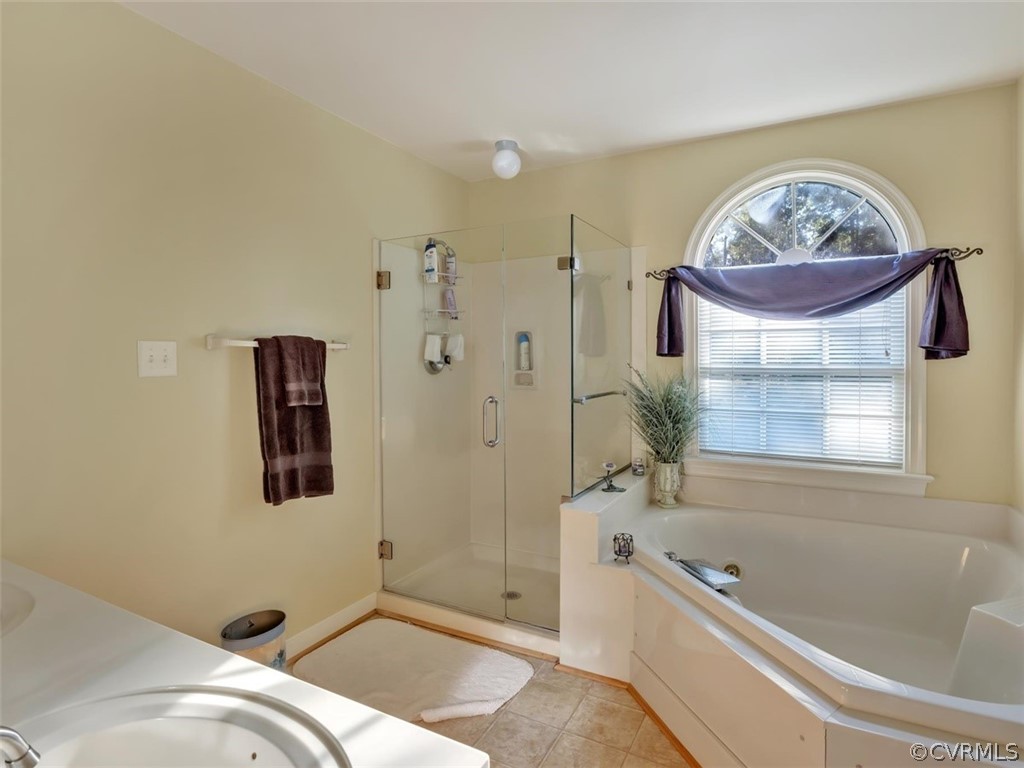 15211 Powell Grove Road Midlothian, VA 23112 - Photo 19 of 34 a bathroom with a tub sink and mirror