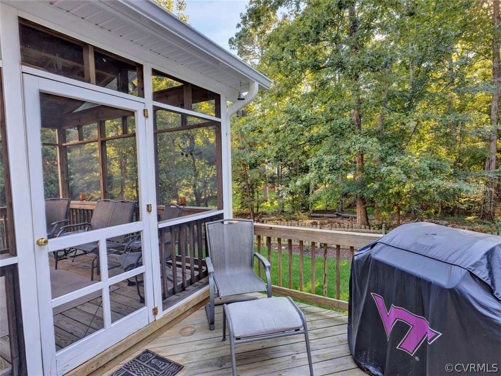 15211 Powell Grove Road Midlothian, VA 23112 - Photo 25 of 34 a view of a deck with wooden floor and outdoor seating