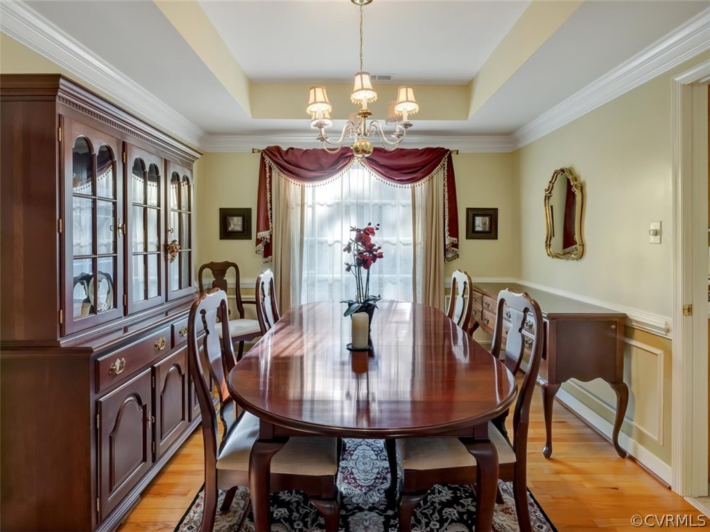 15211 Powell Grove Road Midlothian, VA 23112 - Photo 6 of 34 a view of a dining room with furniture window and wooden floor