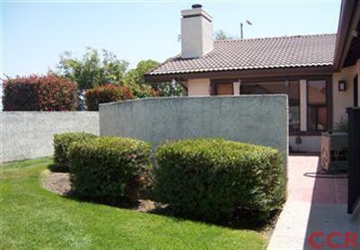 1224 Jamie Loop Santa Maria, CA 93454 - Photo 1 of 14 a front view of a house with garden