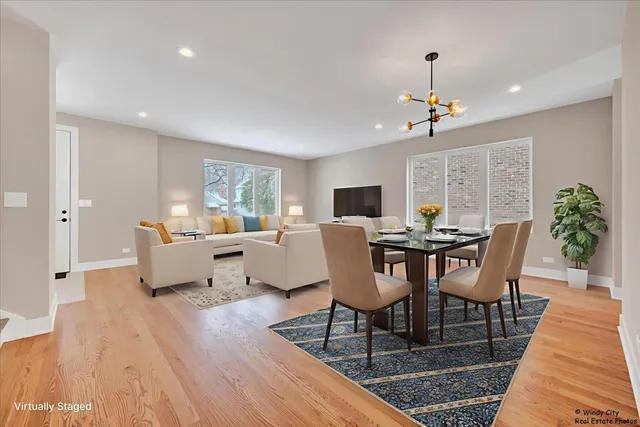 a view of a dining room with furniture window and wooden floor