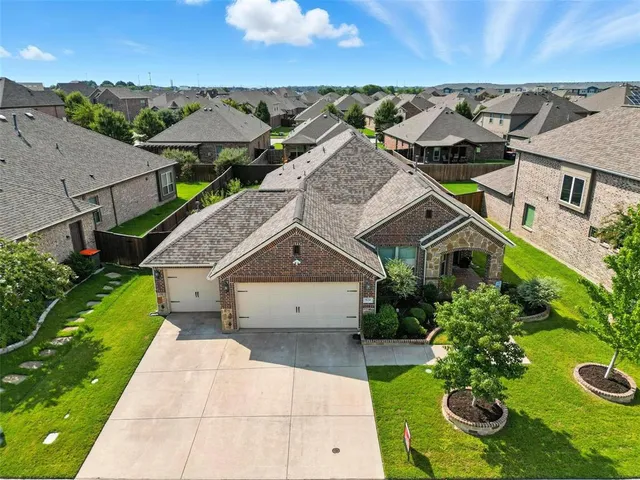 an aerial view of a house with garden