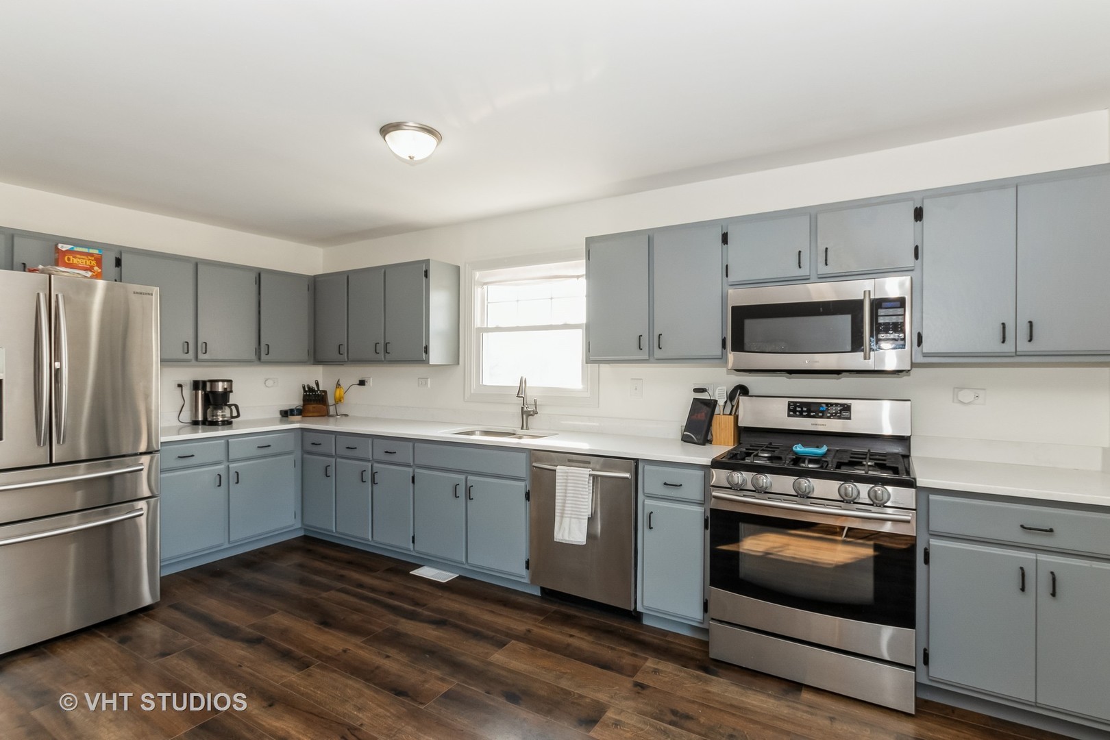 757 Longlane Road New Lenox, IL 60451 - Photo 7 of 16 a kitchen with white cabinets and appliances