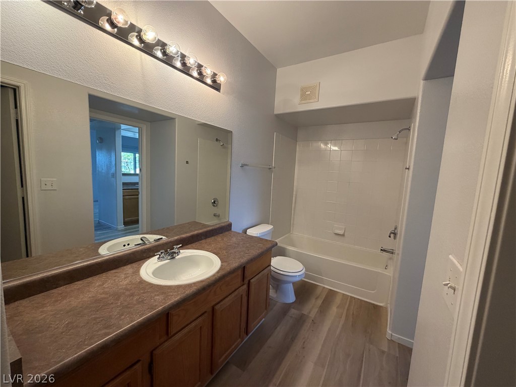 7255 West Sunset Road, Unit 1158 Las Vegas, NV 89113 - Photo 9 of 10 A well-appointed bath features a spacious vanity and a combination tub-shower.