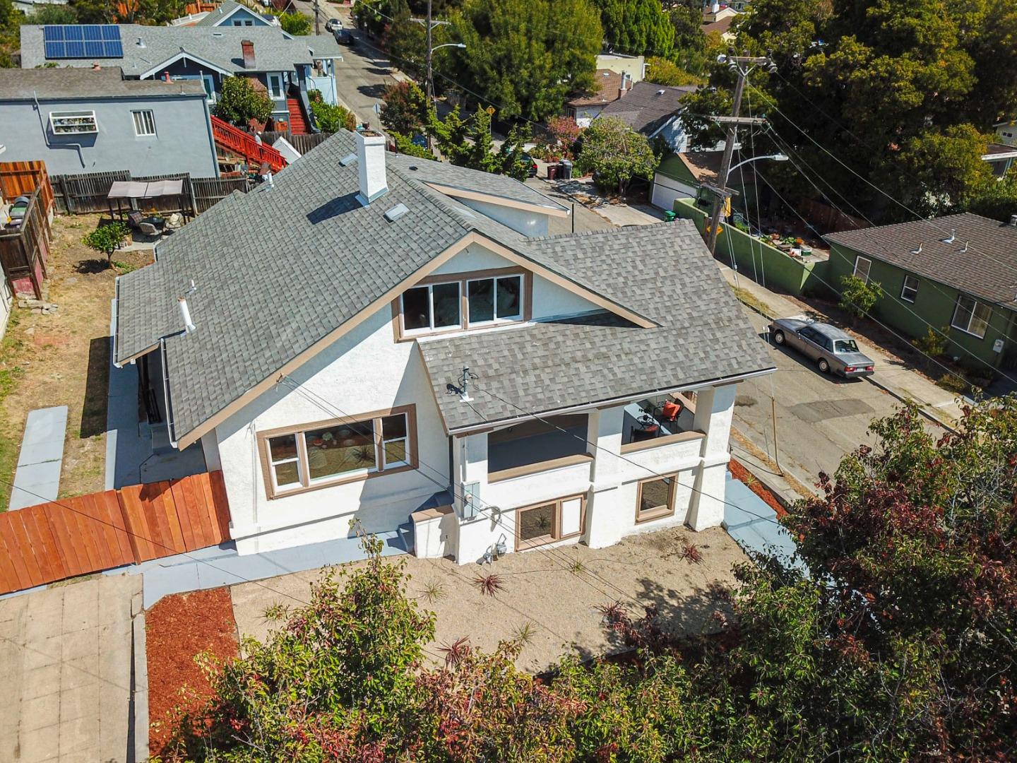 an aerial view of a house with a large tree