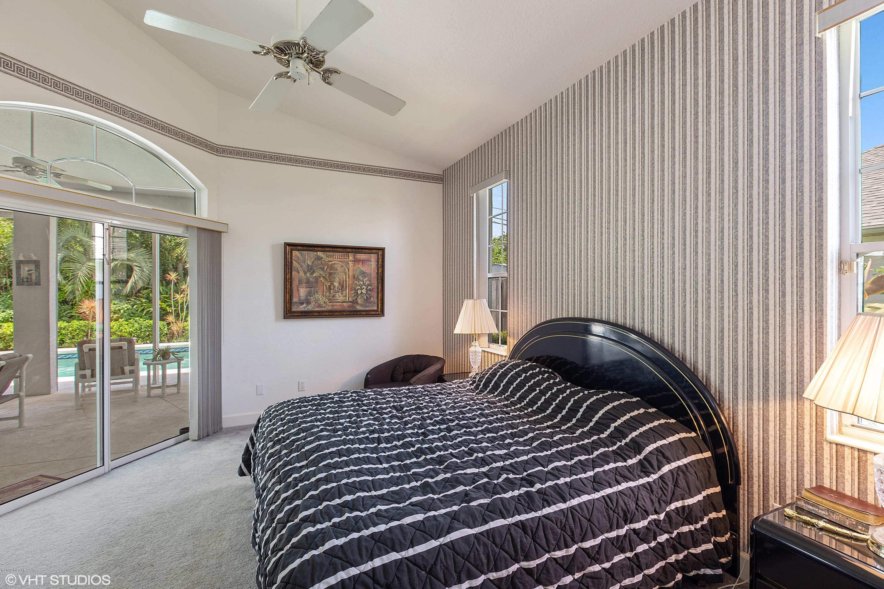 70 Buschman Drive Ponce Inlet, FL 32127 - Photo 18 of 31 Master Suite Poolside