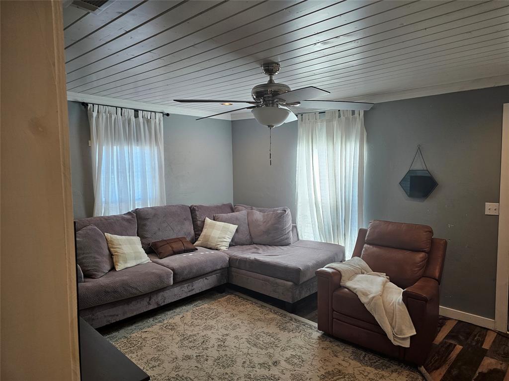 165 Elmwood Road Whitney, TX 76692 - Photo 9 of 28 Living room with wood finished floors, ceiling fan, and wooden ceiling