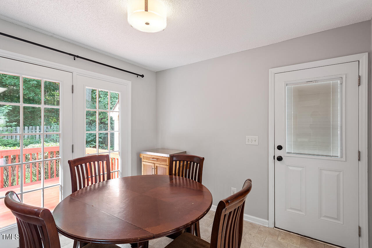 2108 Cedarbluff Court Raleigh, NC 27615 - Photo 10 of 38 a view of a dining room with furniture window and wooden floor