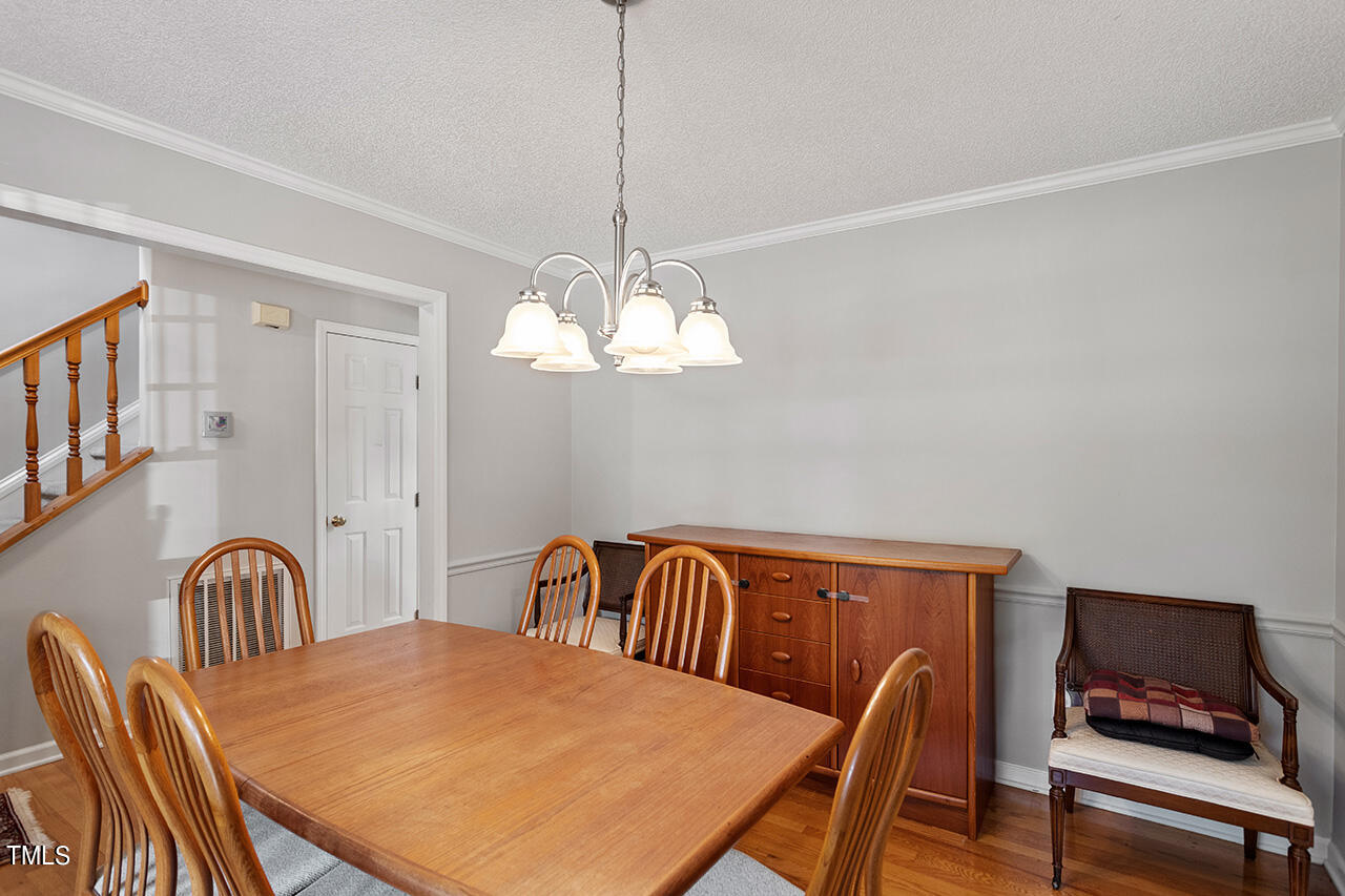 2108 Cedarbluff Court Raleigh, NC 27615 - Photo 17 of 38 a view of a dining room with furniture