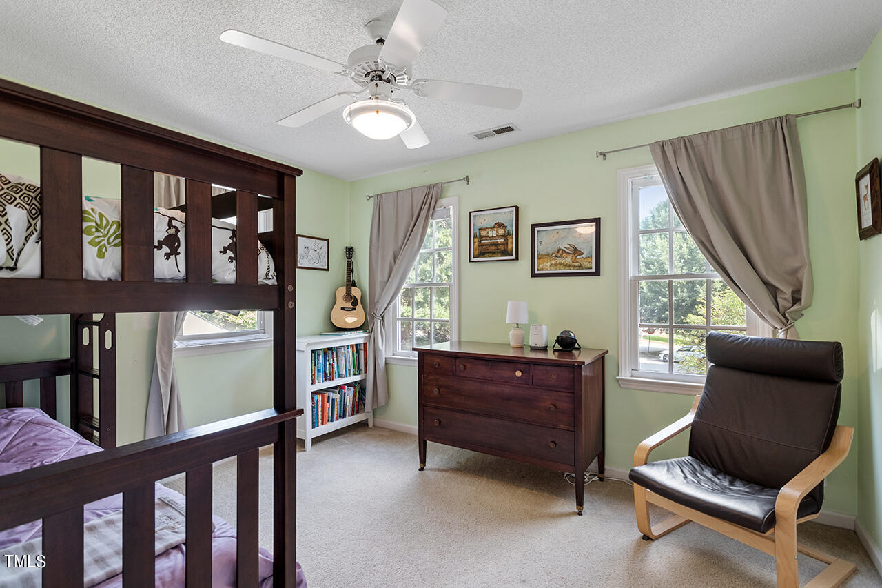 2108 Cedarbluff Court Raleigh, NC 27615 - Photo 26 of 38 a living room with furniture and a window