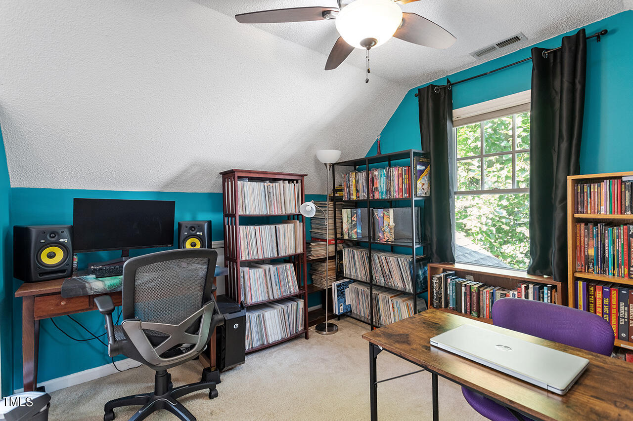 2108 Cedarbluff Court Raleigh, NC 27615 - Photo 29 of 38 a reading room with furniture book shelf and a window