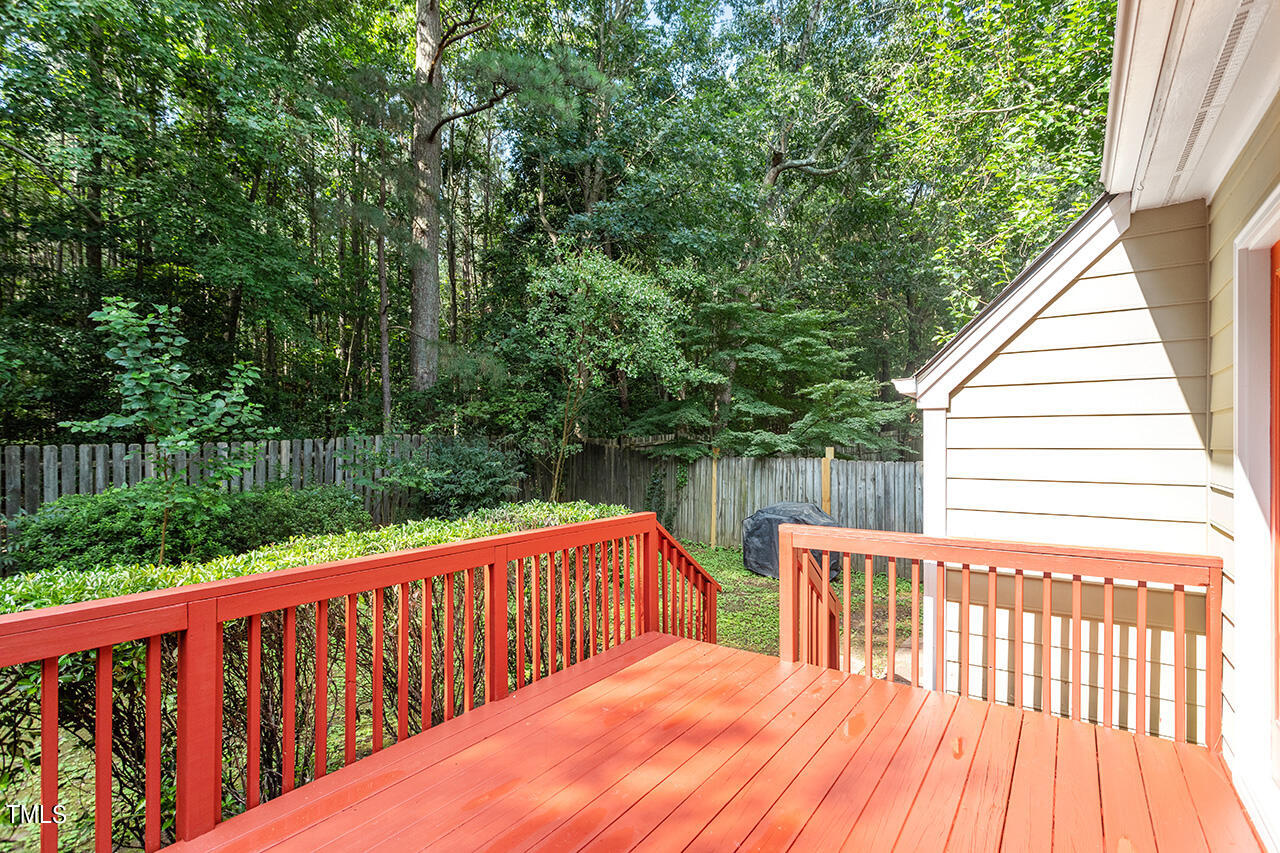 2108 Cedarbluff Court Raleigh, NC 27615 - Photo 32 of 38 a balcony with trees in front of it