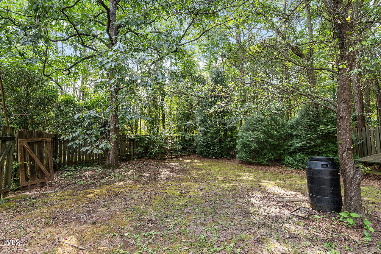 2108 Cedarbluff Court Raleigh, NC 27615 - Photo 35 of 38 a view of a field with trees in the background