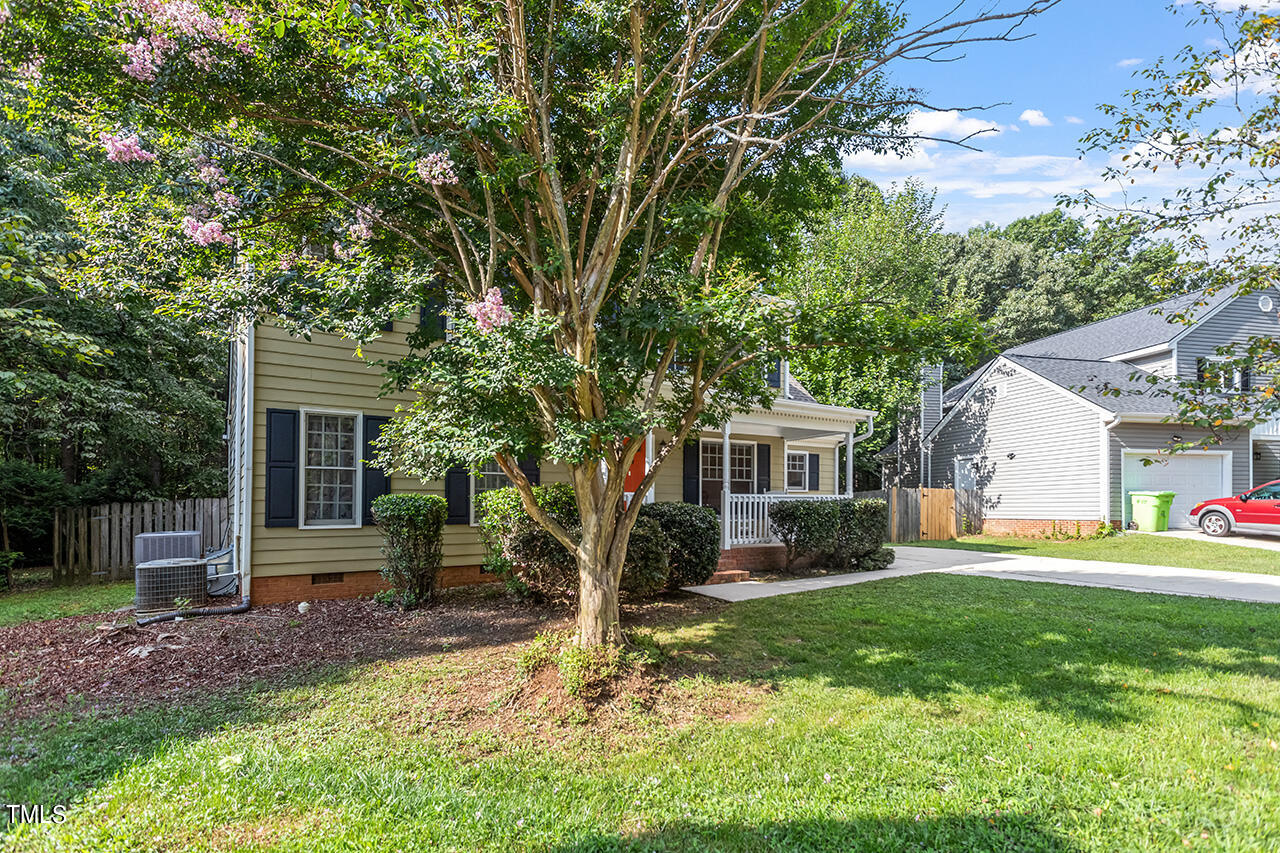 2108 Cedarbluff Court Raleigh, NC 27615 - Photo 37 of 38 a front view of house with a garden and trees