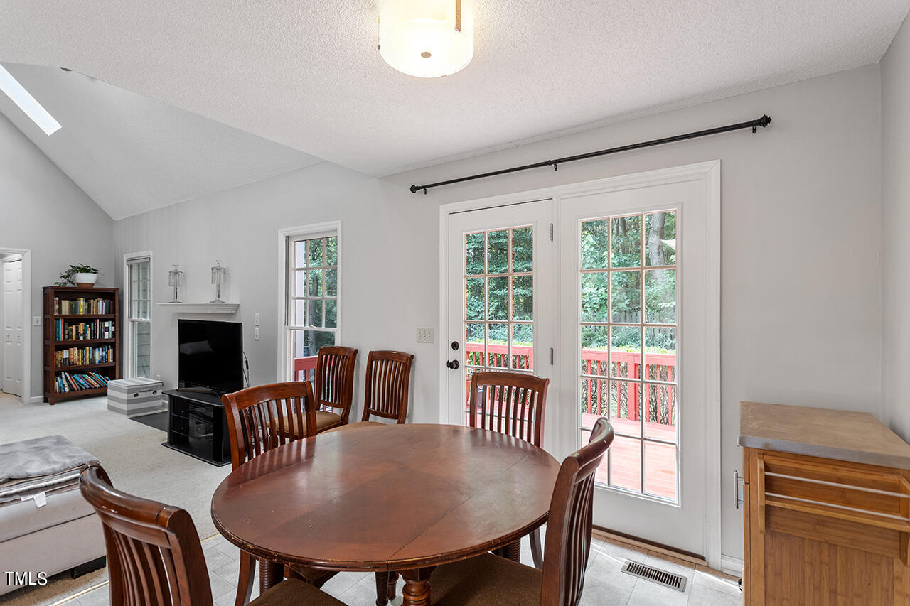 2108 Cedarbluff Court Raleigh, NC 27615 - Photo 8 of 38 a view of a dining room with furniture window and wooden floor