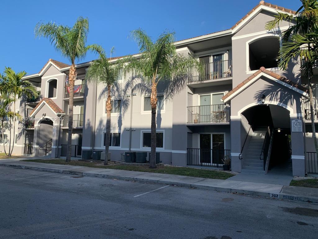 15422 Southwest 284th Street, Unit 7107 Homestead, FL 33033 - Photo 1 of 5 a view of multiple house with a road
