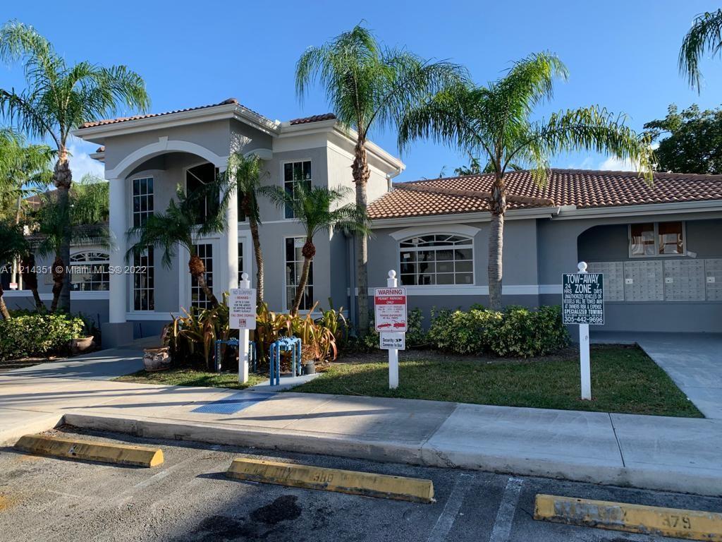 15422 Southwest 284th Street, Unit 7107 Homestead, FL 33033 - Photo 3 of 5 a front view of a house with garden