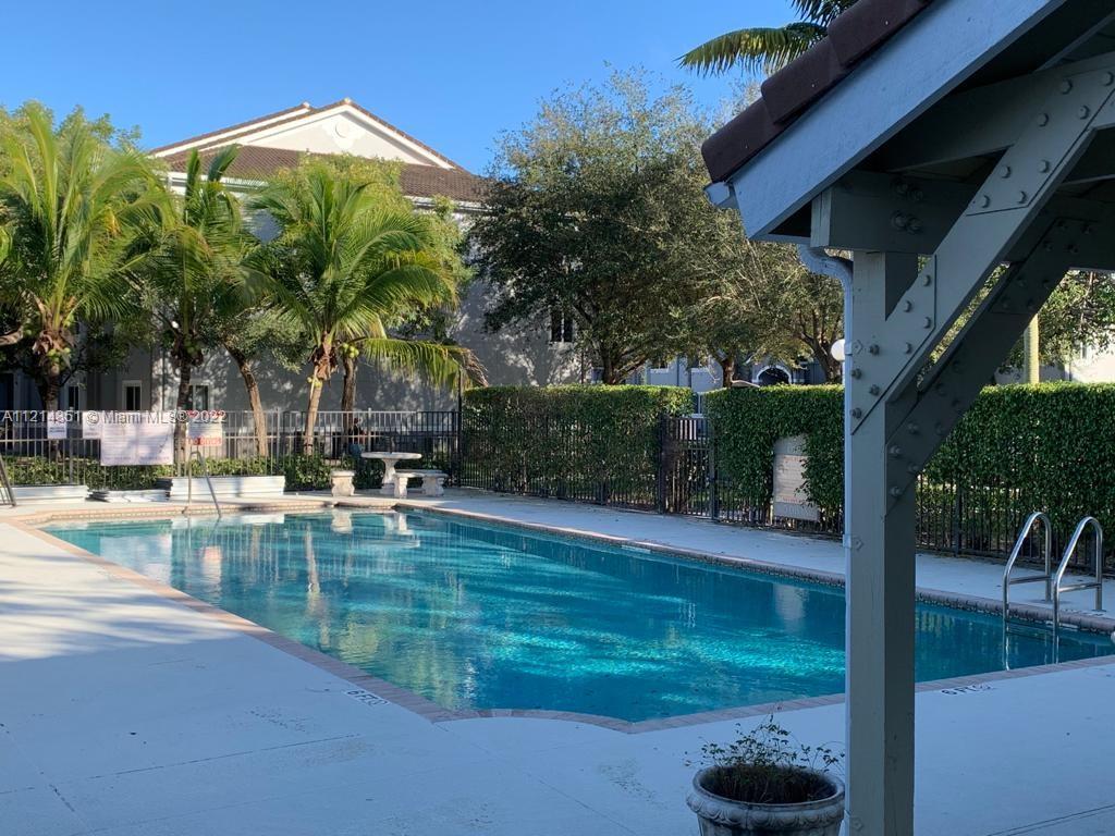 15422 Southwest 284th Street, Unit 7107 Homestead, FL 33033 - Photo 5 of 5 a view of a swimming pool with a patio