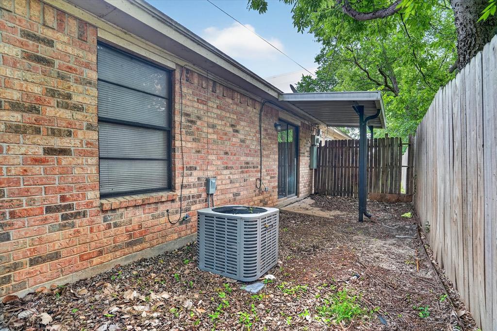 119 Del Rio Avenue, Unit C Benbrook, TX 76126 - Photo 16 of 17 a front view of a house with a garden