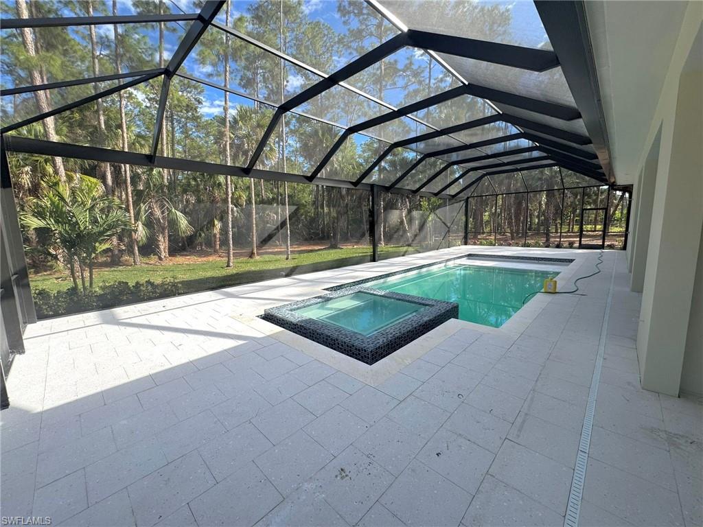 1618 19th Street Southwest Naples, FL 34117 - Photo 3 of 3 a view of swimming pool with a yard and sitting space