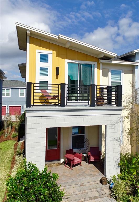 8555 Pinter Street Orlando, FL 32827 - Photo 1 of 1 Front of the house with master balcony and front porch